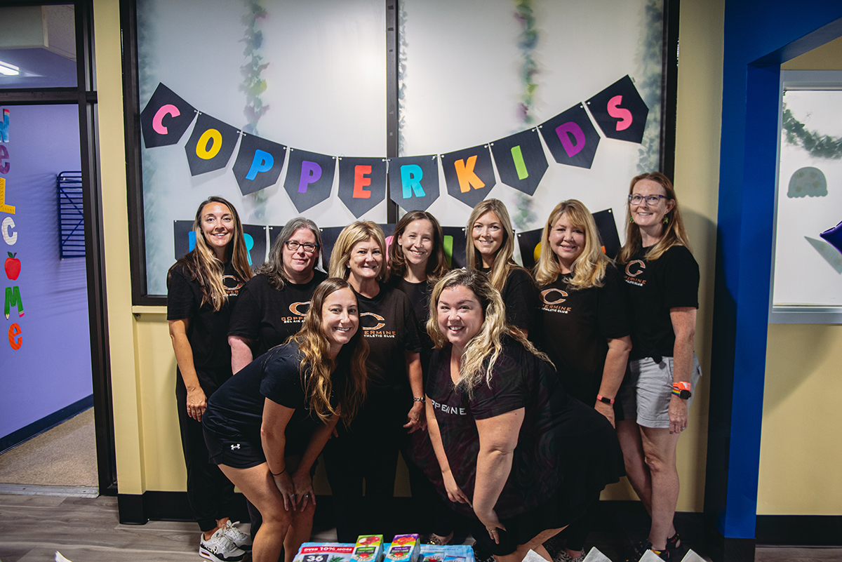 The caring and dedicated staff at Coppermine's CopperKids Preschool ensure each classroom is a safe, inviting space for children to explore and learn. Coppermine's "Daycare and Preschool" staff smiling before arranging the classroom for a day of fun activities.